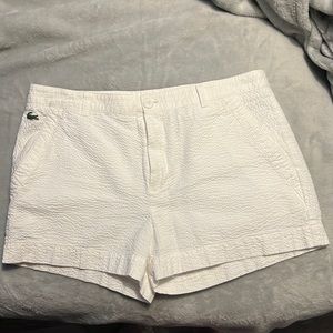 White Lacoste shorts